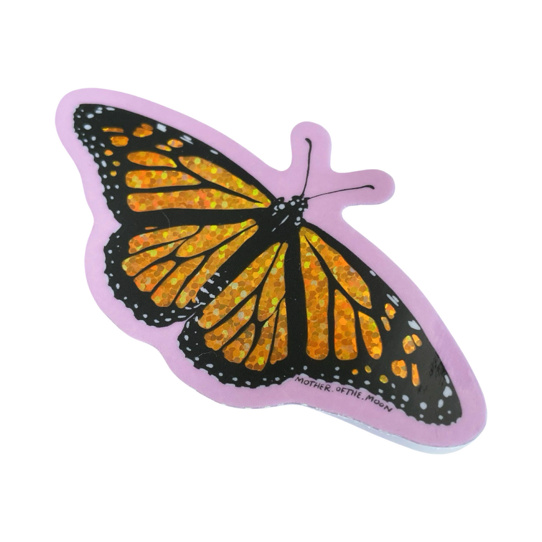 glitter sticker of a monarch butterfly with a purple outline.