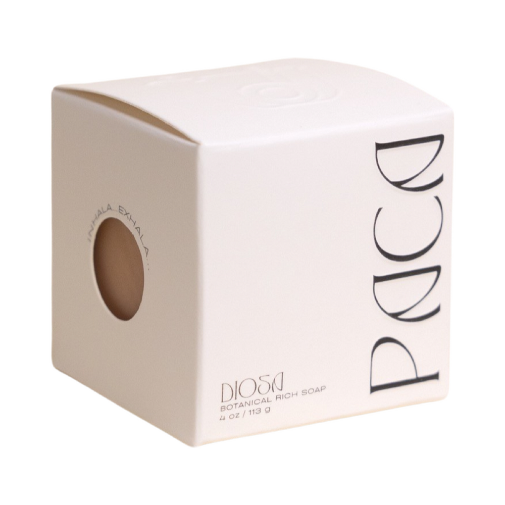 white branded cube box with black lettering. Brand: Paca Botánica
