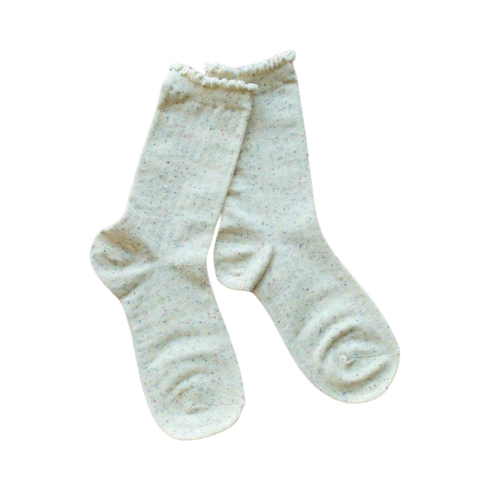 ivory colored pair of socks with multi-colored speckles
