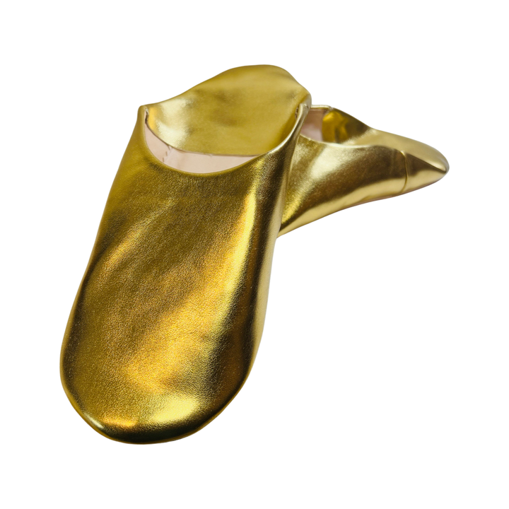 gold pair of moroccan leather babouche slippers