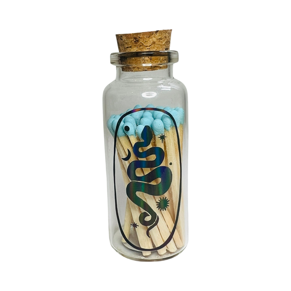 clear jar with a cork filled with matches featuring a holographic images of a snake