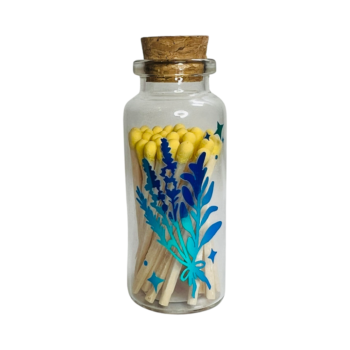 clear jar with a cork filled with matches featuring a holographic images of a bundle of herbs
