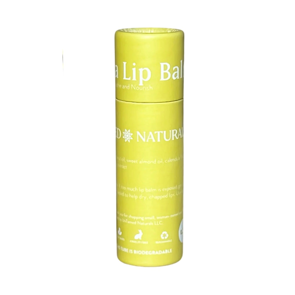 single tube of lip balm with yellow branded labeling and white lettering. Brand: UnTamed Naturals