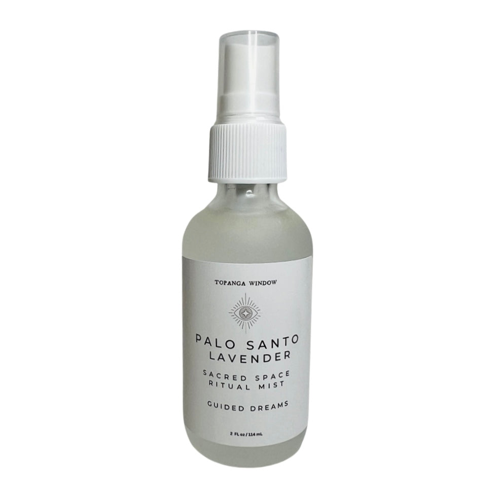 frosted 2 oz bottle of palo santo lavender mist with a white branded label. Brand: Topanga Window