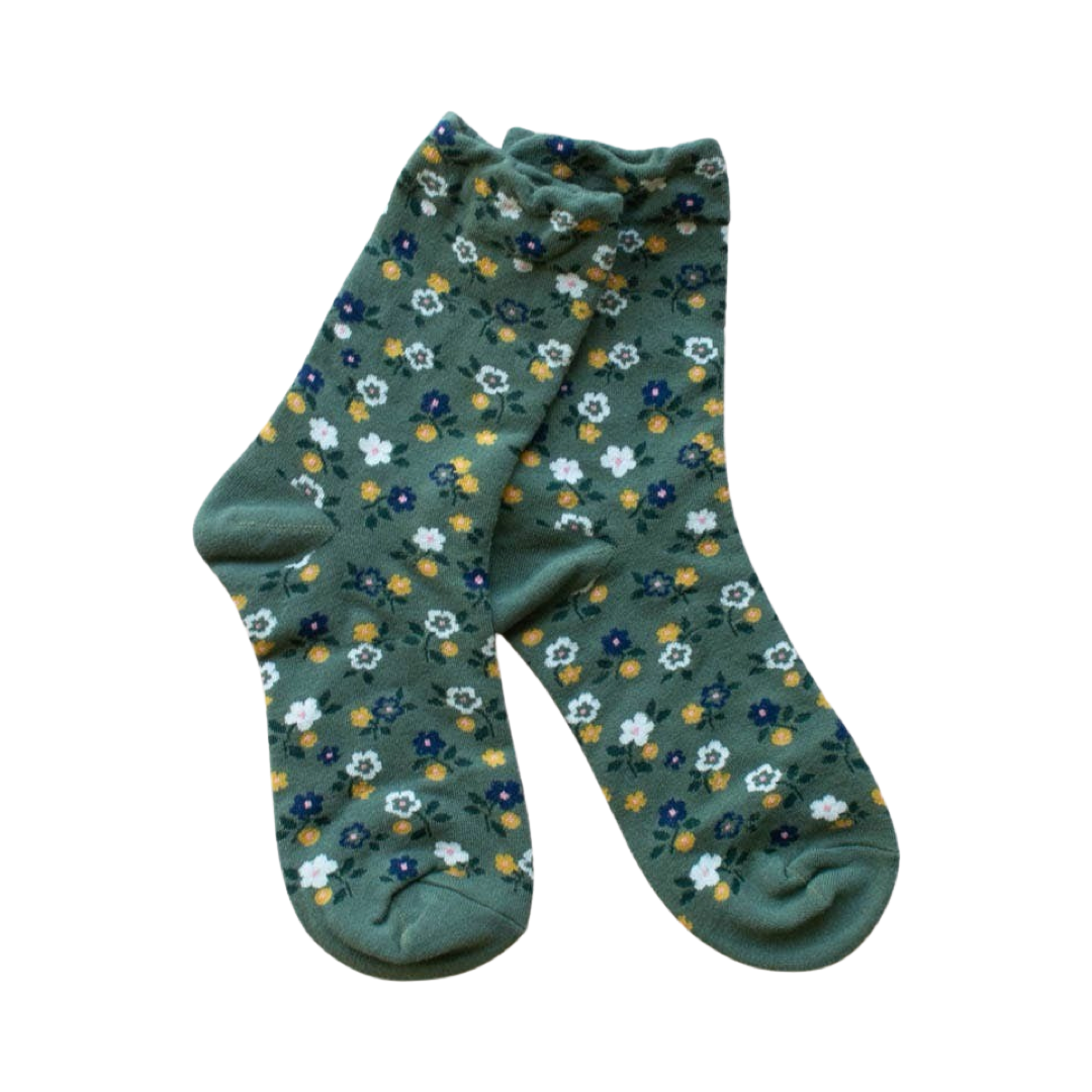 pair of green socks with white, yellow and blue flowers