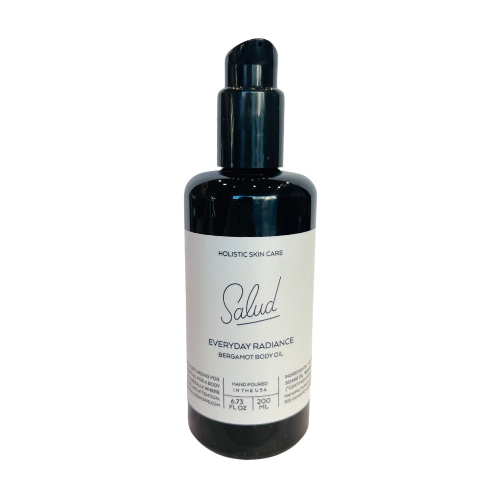 6.73 oz dark brown bottle of Salud everyday Radiance body oil with a white branded label. Brand: Salud