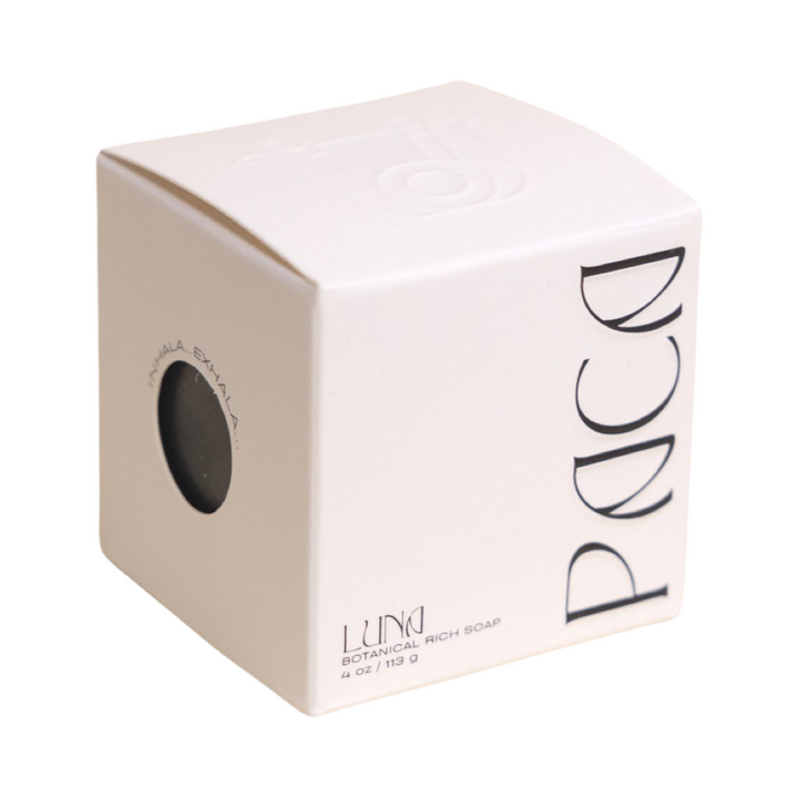 white branded cube shaped box with black lettering. Brand: Paca Botánica