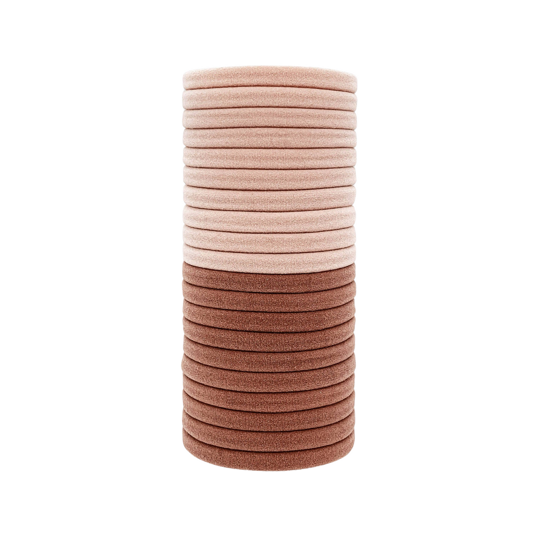 stack of light pink and dusty rose elastic hair ties. Brand: Kitsch