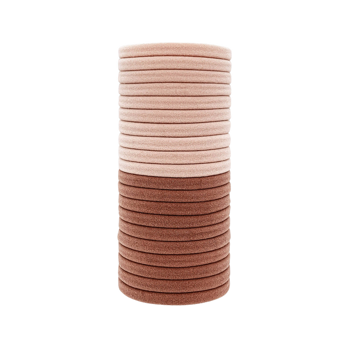 stack of light pink and dusty rose elastic hair ties. Brand: Kitsch