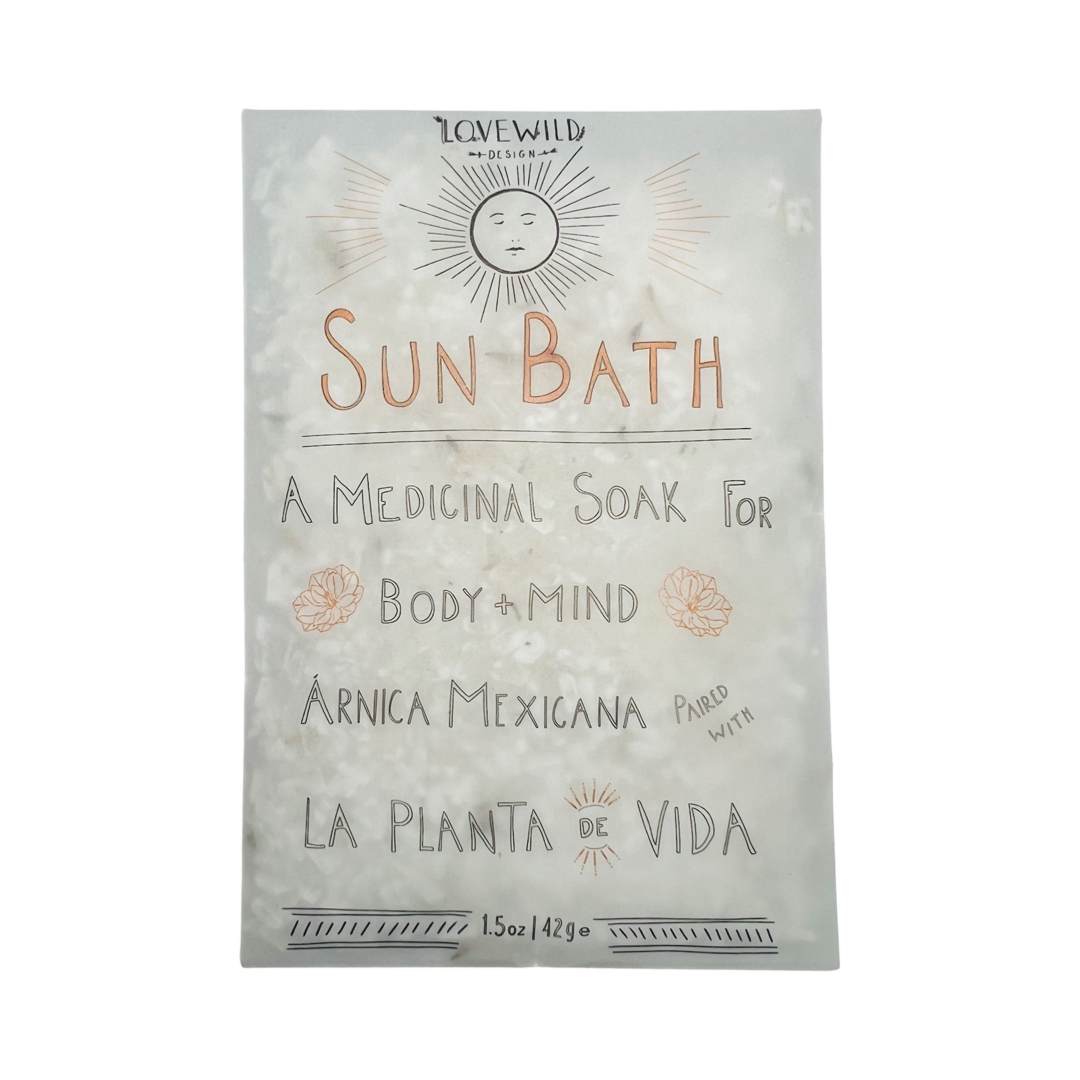 1.5 oz white pouch of bath salt with branded label and a sketch of a sun. Brand: Lovewild Design