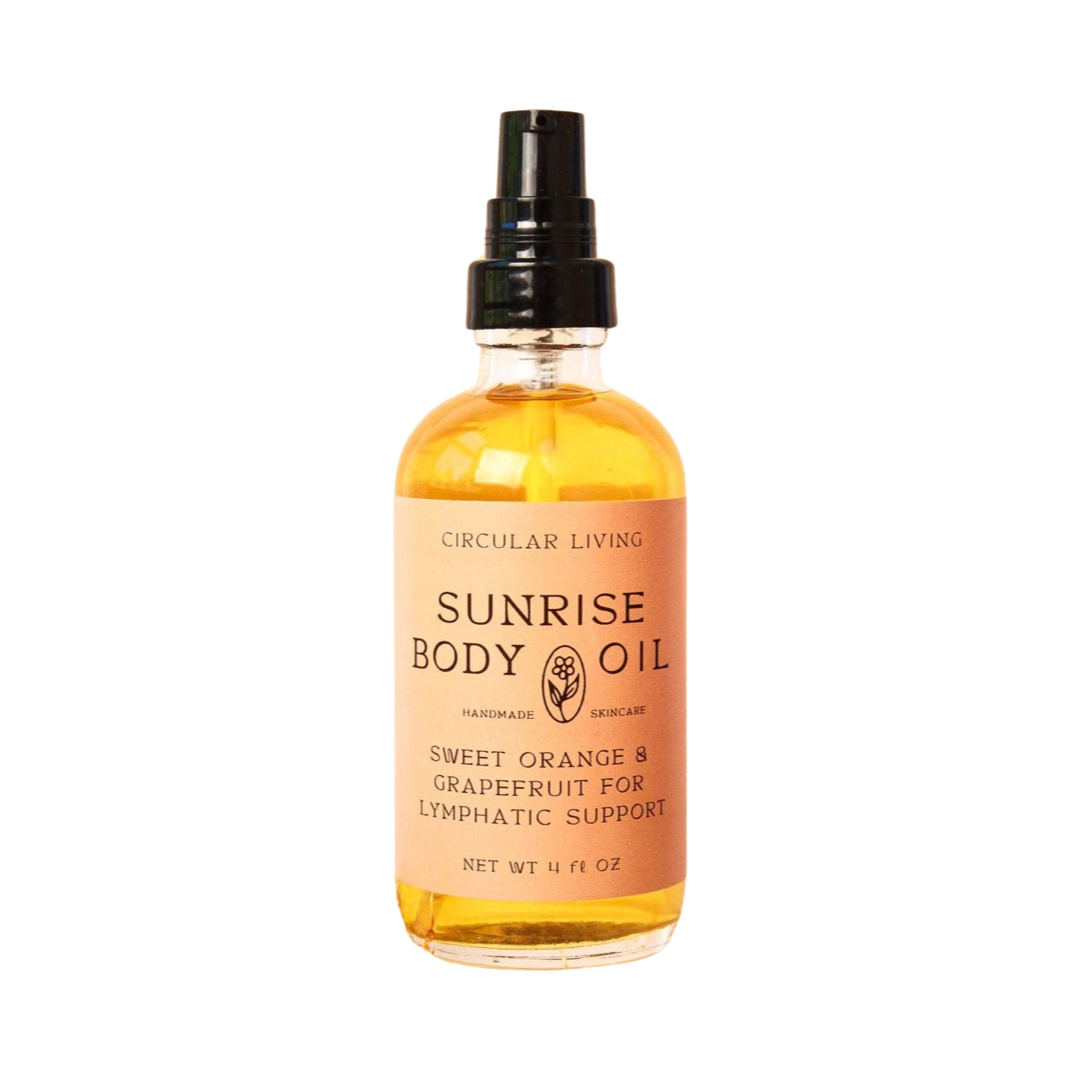 clear 4 oz clear bottle of sunrise body oil with a peach branded label. Brand: Circular Living