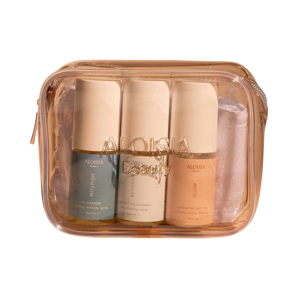 clear light pink bag with 3 containers of product and a white head band. Brand: Aloisia Beauty