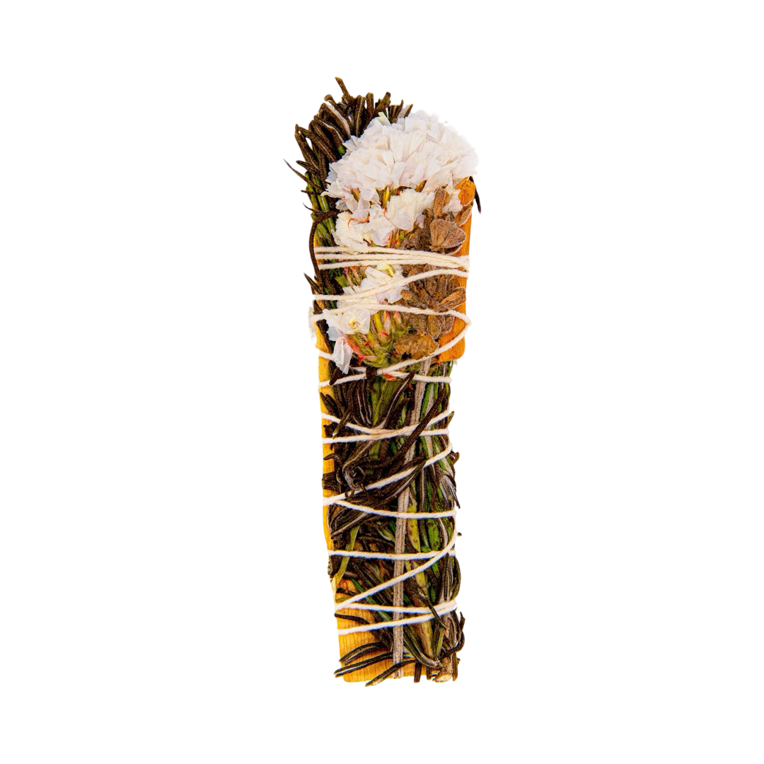 A Palo Santo, White Sinuata Flower, Lavender, Rosemary, and Cinnamon bundle tied with white twine.