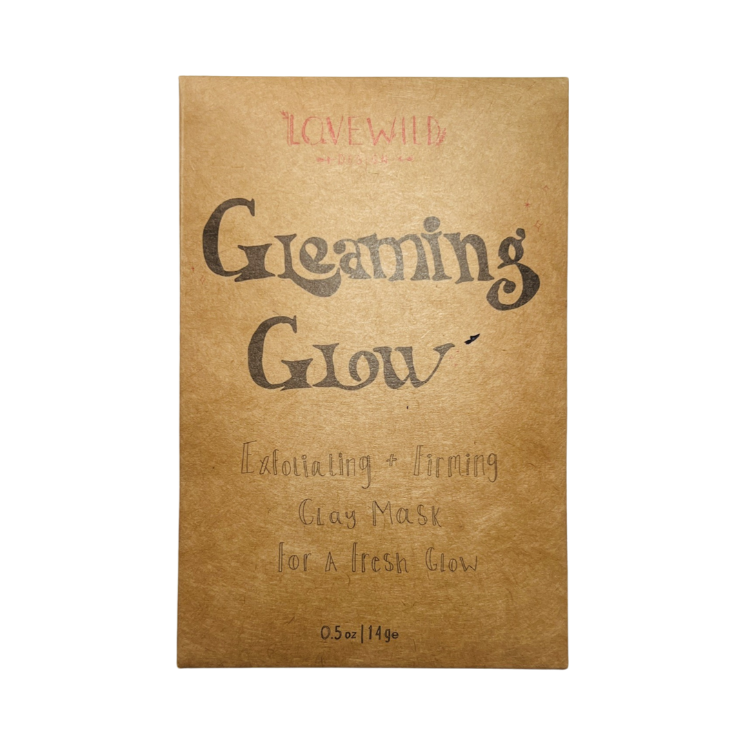 kraft paper pouch of Gleaming Glow clay mask with black lettering. Brand: Lovewild Design
