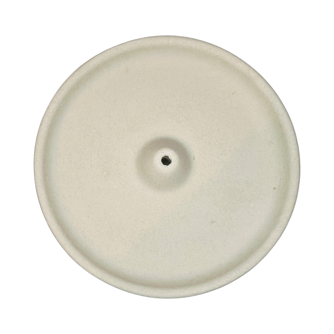 top view of a round sand colored incense holder