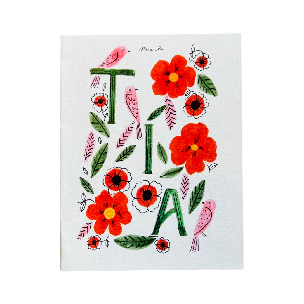 white card with red flowers and pinks birds featuring the word TIA in green