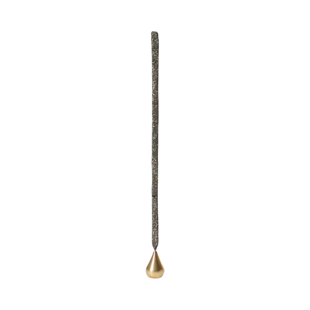 brass waterdrop shaped incense holder with an incense stick. Brand: Cedar and Myrrh