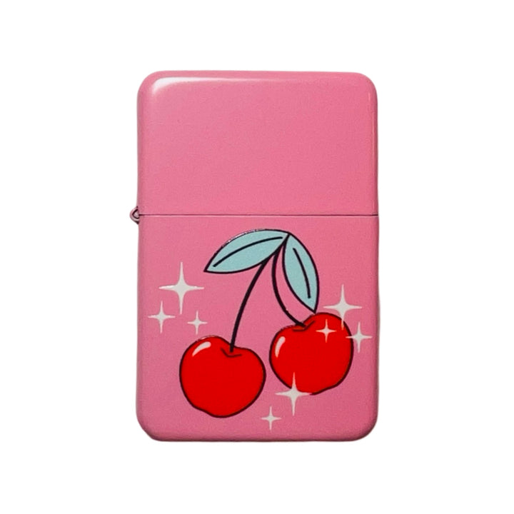 A pink flip-top lighter with a vibrant cherry illustration and sparkling details.