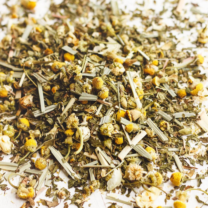 close up view of chamomile, spearmint and lemongrass tea leaves.
