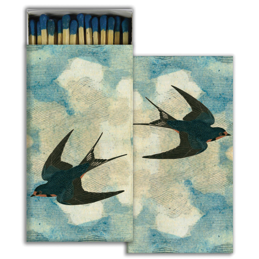set of matches with a cloud design on the boxes and sparrows. one box is opened with exposed matches
