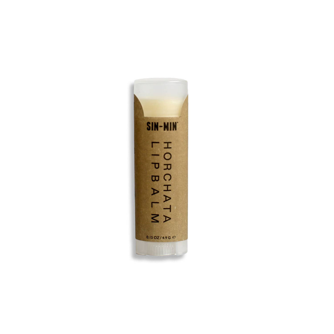 /15 oz tube of lip balm with a kraft label and the product and brand name in black lettering.. Brand: Sin-min