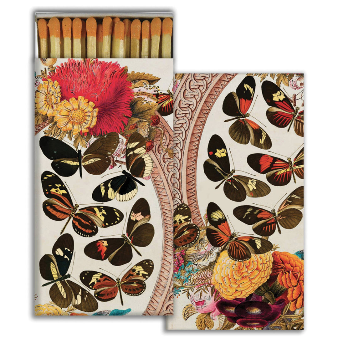 set of matches in white boxes with imgaes of various butterflies and flowers. One box is opened with exposed matches