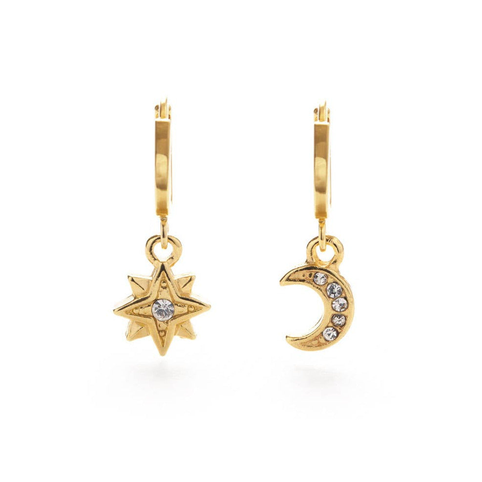 set of gold earrings in the shape of a moon and star featuring a crystals in the center. Brand: Amano Studio
