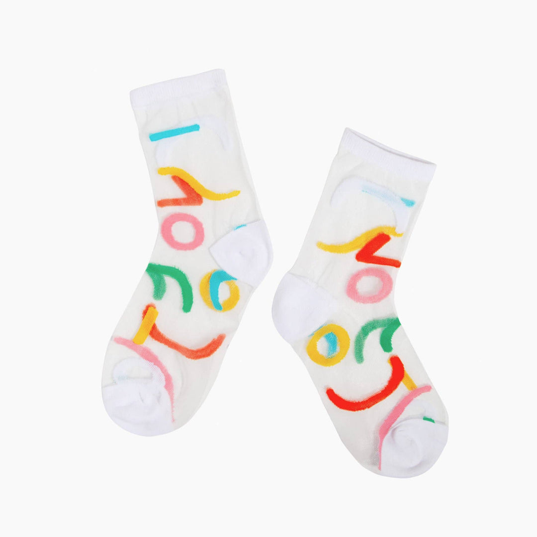 pair of sheer socks featuring a contemporary, abstract design and bold yellow accents