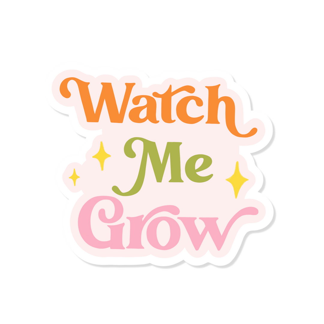white sticker with the phrase Watch Me Grow in orange, green and pink lettering