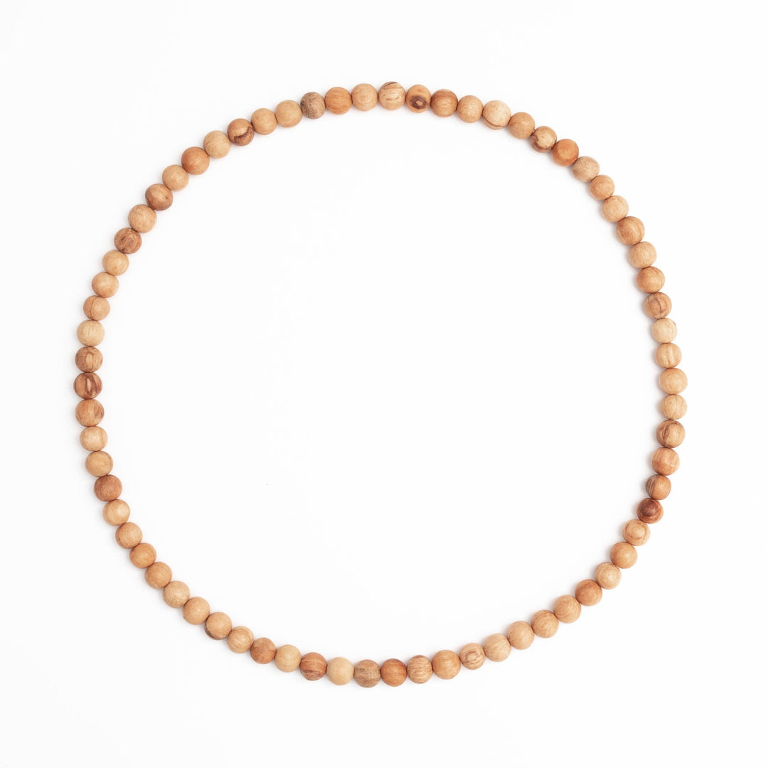 necklace made up of palo santo beads. Brand: Luna Sundara