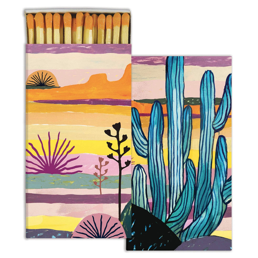 two boxes of matches, one opened and one closed, featuring a colorful sunset and cactus design.