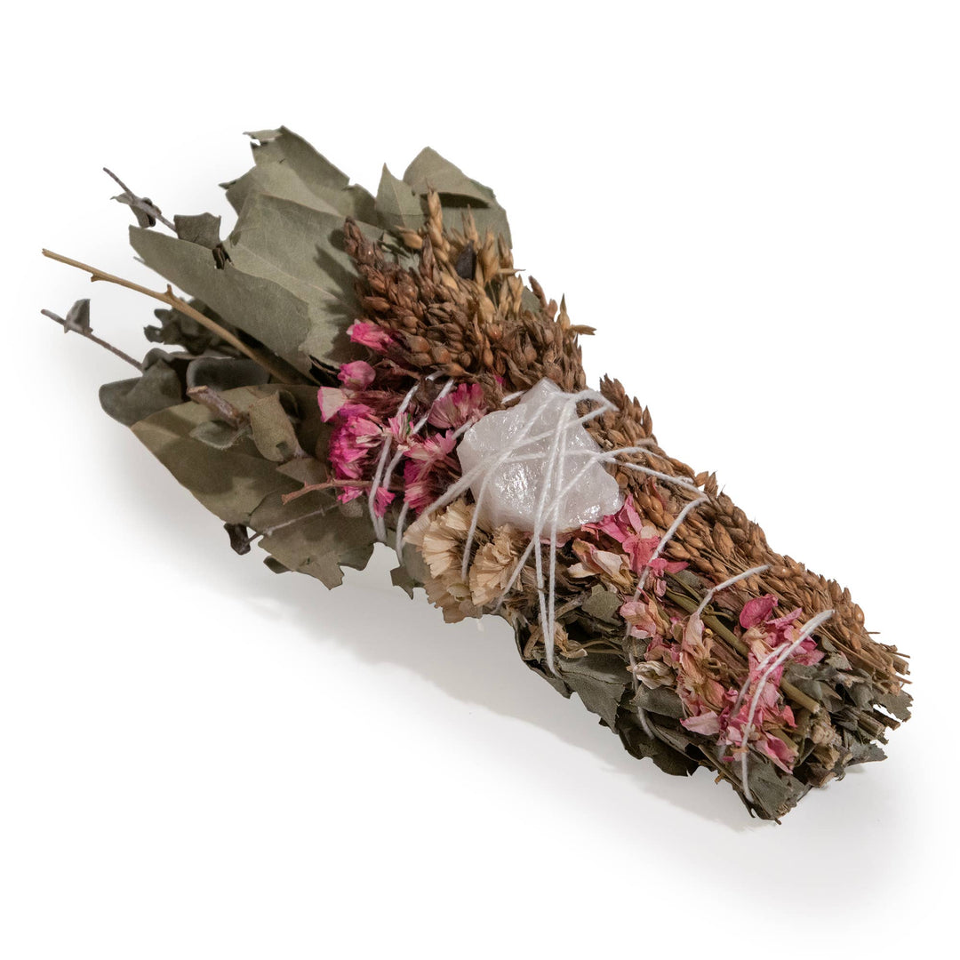  white sage, baby eucalyptus, white and pink statice flowers, sorghum, and a rose quartz crystal tied together with a thin white string