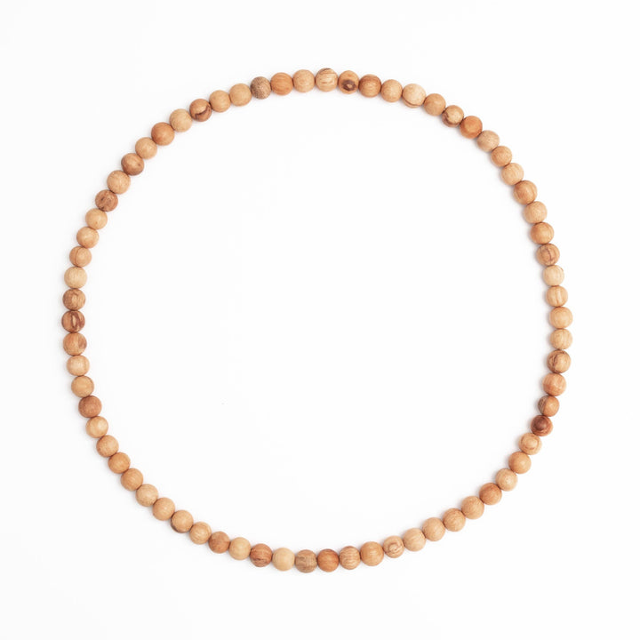 necklace made up of palo santo beads. Brand: Luna Sundara