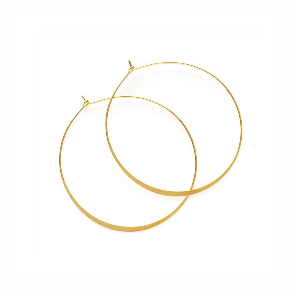 pair of gold hoop earrings. Brand: Amano Studio