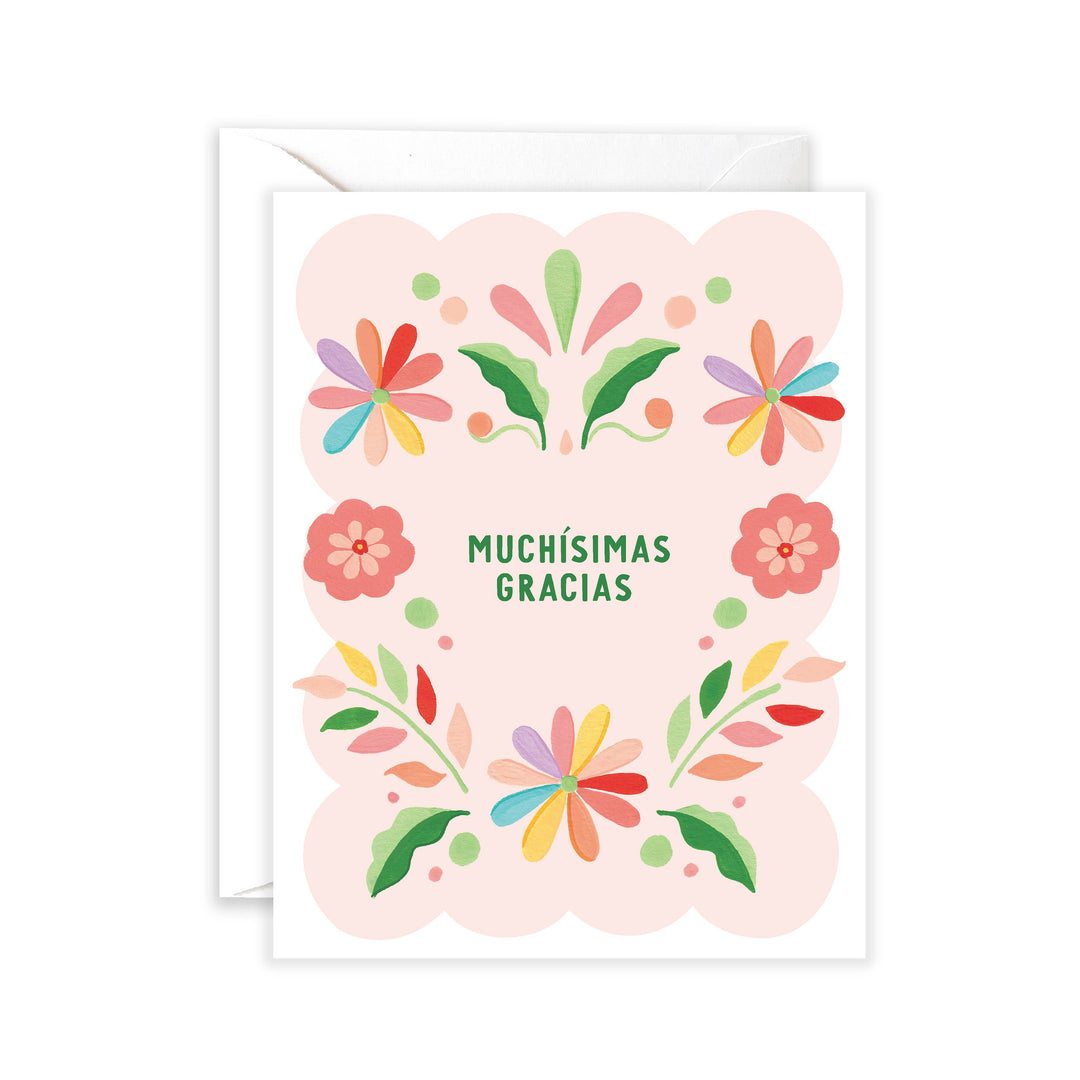 white and light pink card with a colorful otomi inspired design and the phrase Muchisimas gracias in green lettering