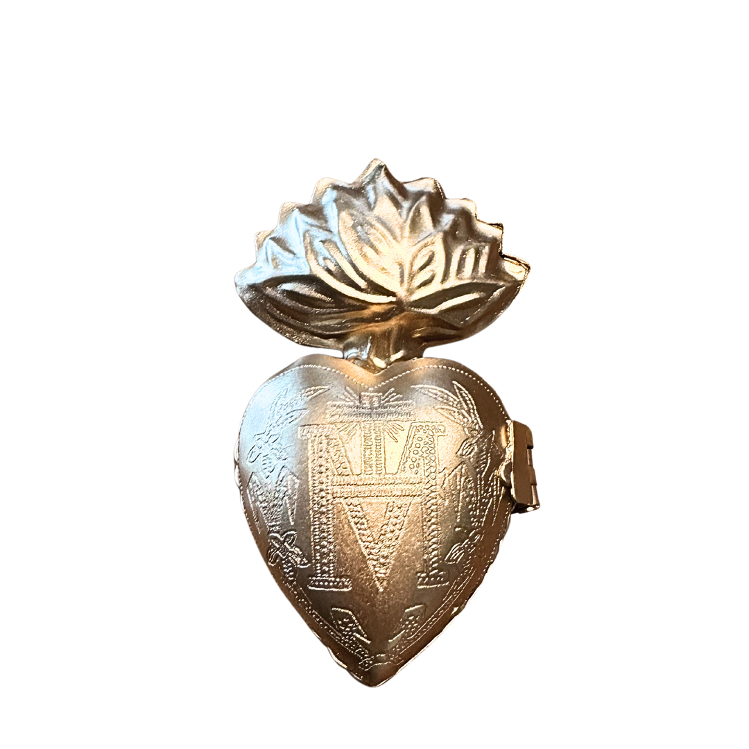 gold sacred heart ornament with an etched design