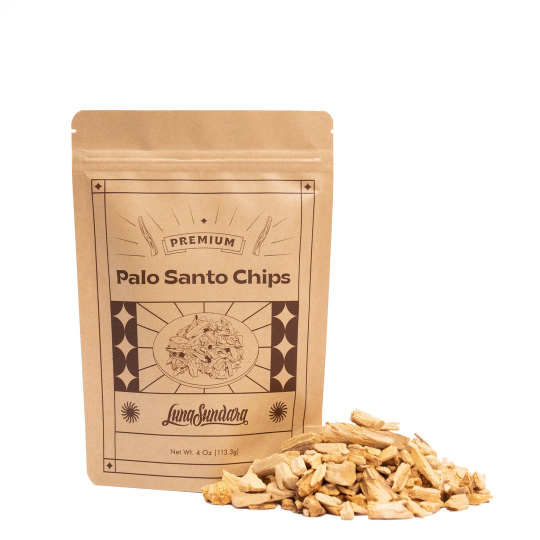 4oz package of Palo santo chips in branded packaging along side a pile of palo santo chips. Brand: Luna Sundara